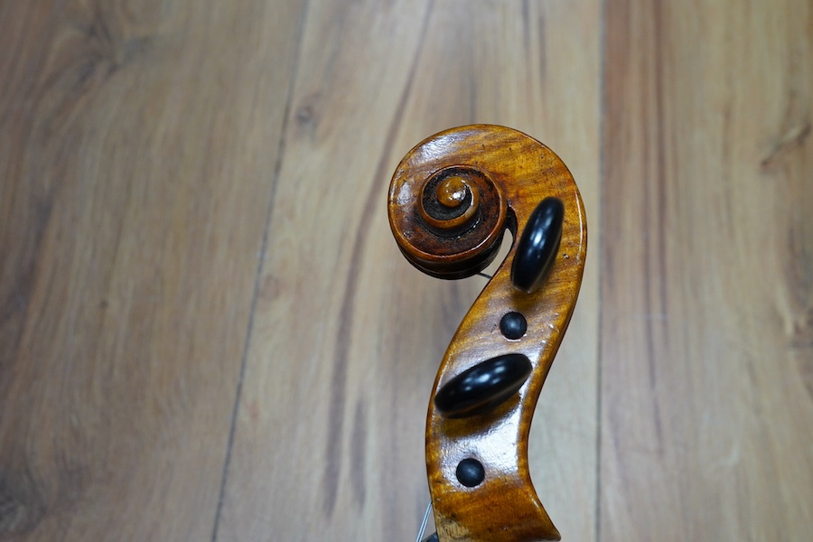 A cased early 20th century European violin, with label reading ‘Antonius Stradivarius Cremonenfis’, body length 36cm, with P&H London bow. Condition - good